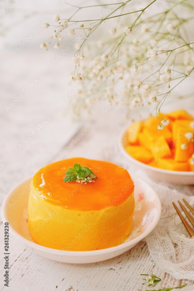 Mango Mousse with sliced ripe mangoes on side, selective focus Mango Mousse with sliced ripe mangoes on side, selective focus
