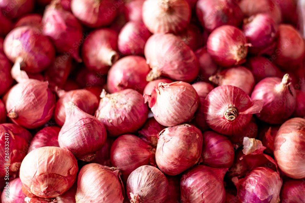 A pile of onions. Onion used in cooking with a pungent taste and smell. selective focus. A pile of onions. Onion used in cooking with a pungent taste and smell. selective focus.