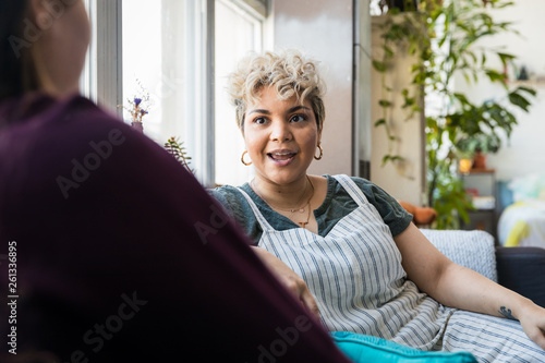 Woman talking with a friend at home