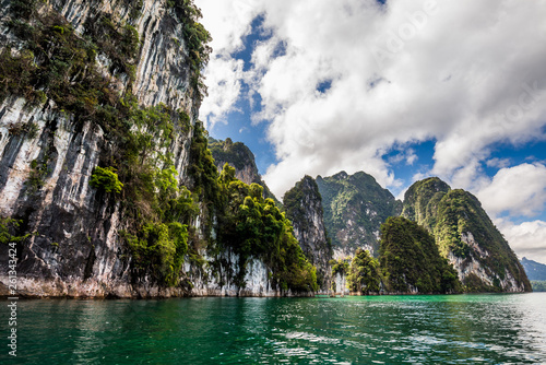 Beautiful nature rock mountains cliff and blue emerald water color lake river with blue clear sky in Ratchaprapa Dam at Khao Sok National Park, Surat Thani Province, Thailand. Asia tourism location. © cattyphoto
