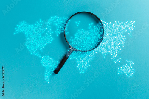 Concept information search. Magnifying glass with international map on blue background. World community and Neural network. New minimal creative concept. Searching information data on internet