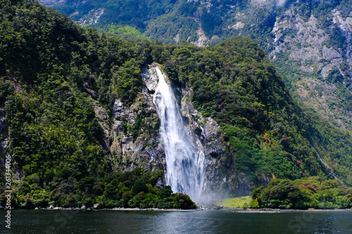 Ship cruise along the mountain range and numerous waterfalls at Milford Sound  South Island  New Zealand