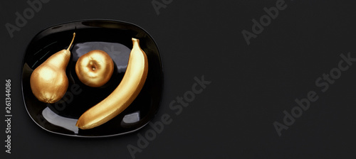 Golden fruits on plate