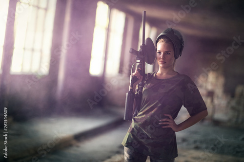 paintball woman with marker gun photo