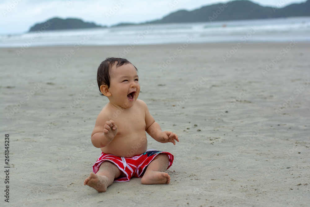 Baby boy in the beach fun traveling with kids funny smile Baby boy in the beach fun traveling with kids funny smile