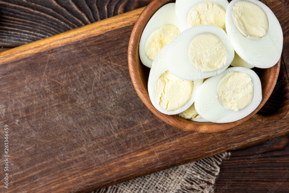 Boiled eggs on dark wooden background. Boiled eggs on dark wooden background.