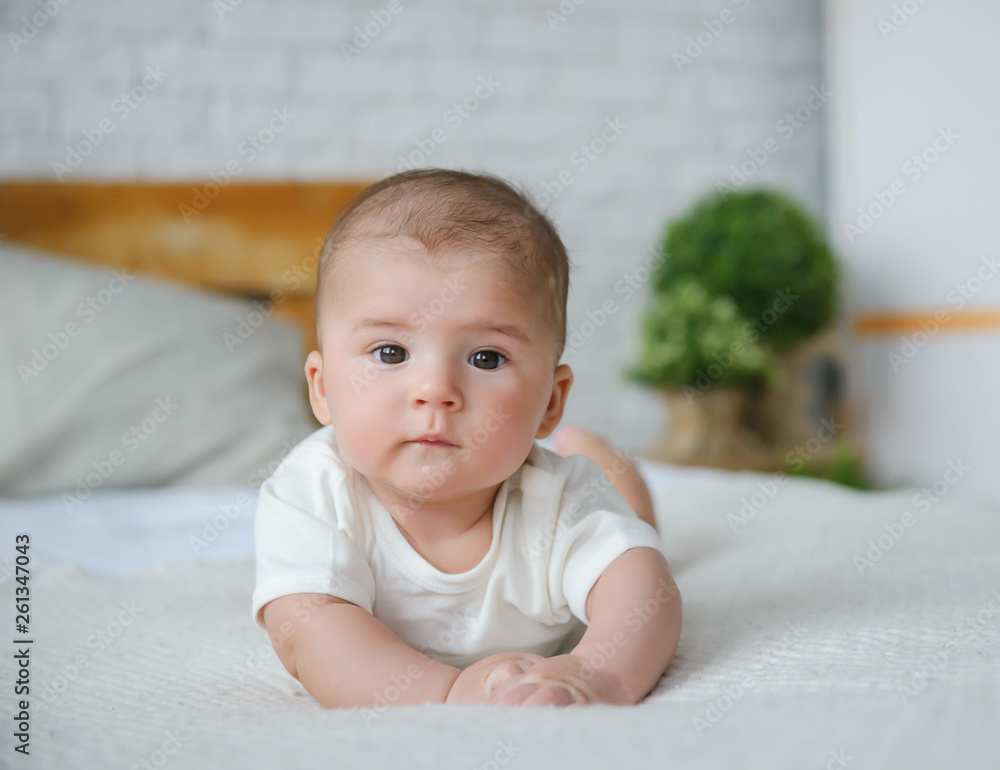Happy baby boy lying down and resting Happy baby boy lying down and resting