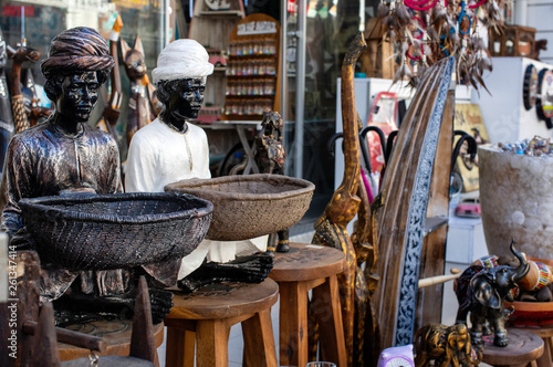Izmir / Turkey - March 30 / 2019 : Statue of two African person on the street of a bazaar in Izmir, Turkey