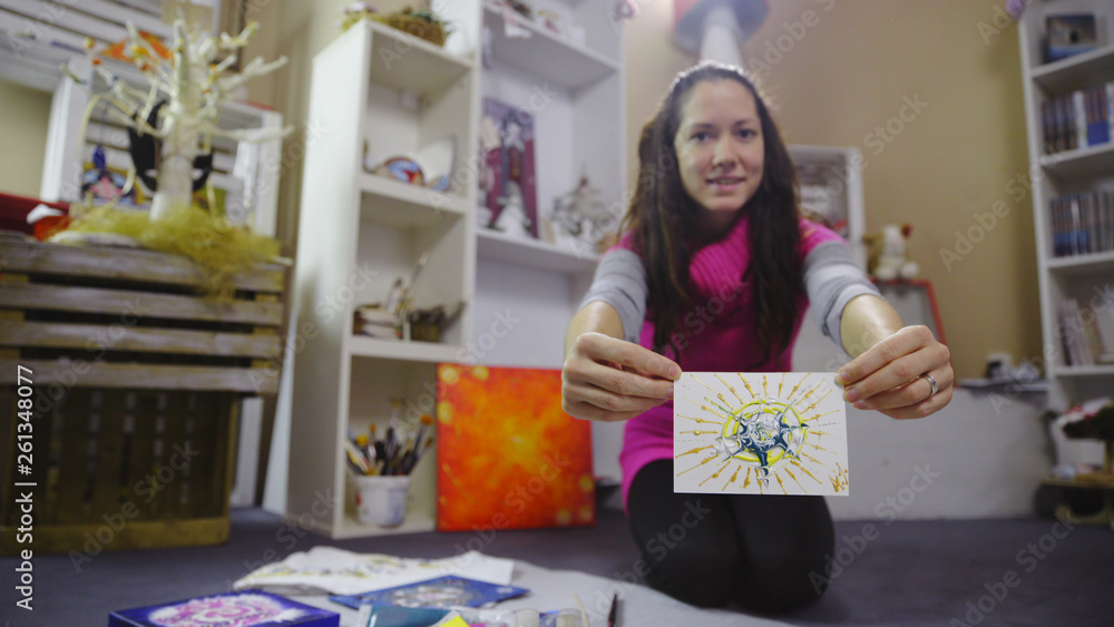 Fototapeta premium Happy woman show a creative painted card