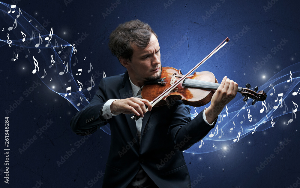 Fototapeta premium Lonely musical composer with violin and sparkling musical notes around