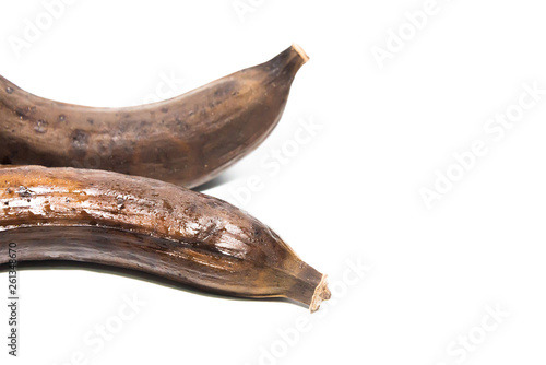 Rotten unhealthy banana isolated on white background. Over ripe banana. Banana expired. photo