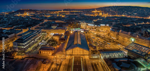 Budapest, Hungary - Aerial panoramic skyline view of Budapest at dusk with illuminated Western Railway Station, Parliament, St. Stephen's Basilica, Buda Castle Royal Palace and Fisherman's Bastion