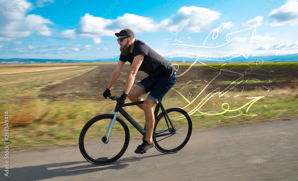 Fototapeta premium Young cyclist in casual clothing with fabulous nature background