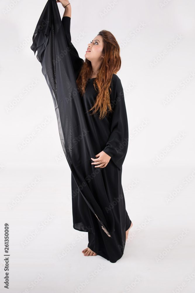 Beautiful Arab woman in traditional dress dancing