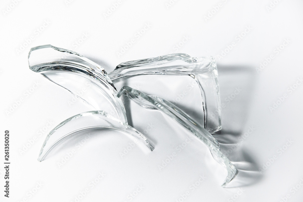 Parts of the broken cup jar glass isolated on white background