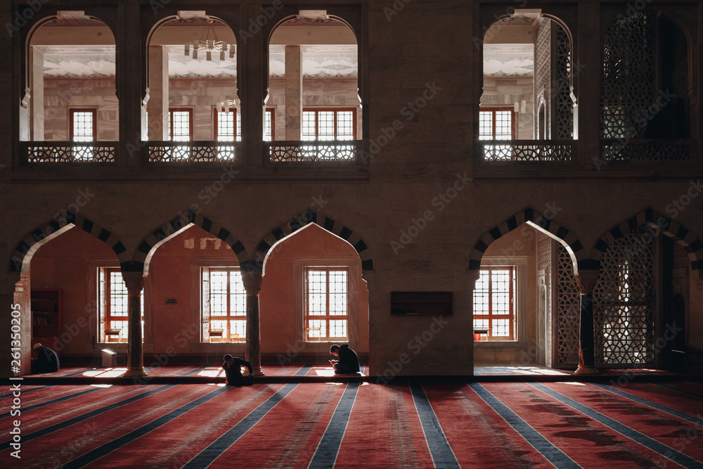 Ankara, Turkey - March 3, 2019:  Praying people inside beautiful Kocatepe Mosque, the largest mosque in Ankar