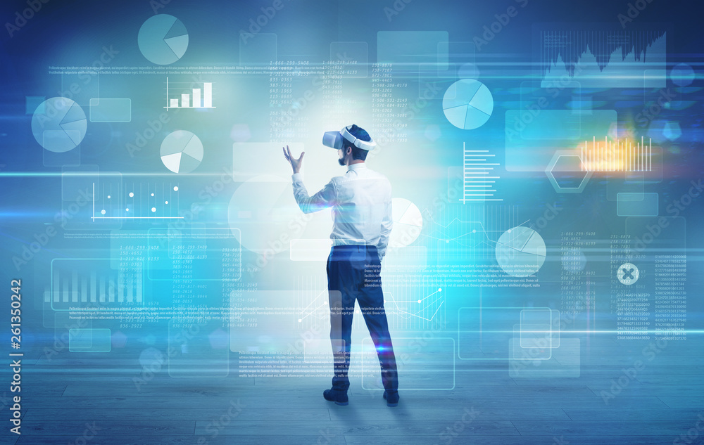 Good looking businessman checking reports and charts with vr glasses
Good looking businessman checking reports and charts with vr glasses