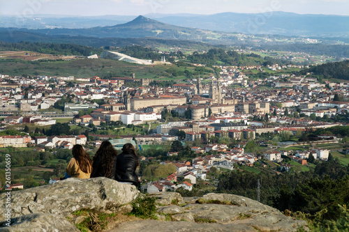 Group of people looking at Santiago de Compostela view photo