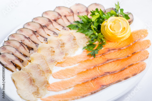 sliced fish on a white plate for a menu