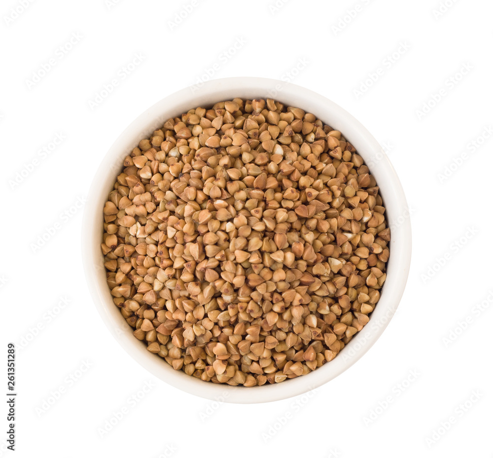 Top view of buckwheat groats in round ceramic plate isolated on white background Top view of buckwheat groats in round ceramic plate isolated on white background