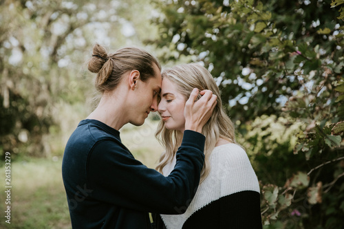 Young Cute Romantic Beautiful Loving Couple Face to Face Looking into Each Others Eyes Outside in Nature