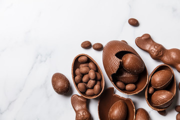 Chocolate easter eggs and bunnies on a marble background
