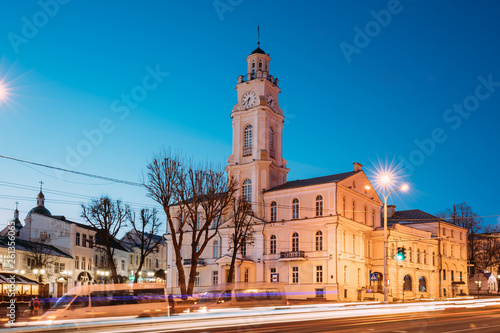 Vitebsk, Belarus. Traffic At Lenina Street And City Hall In Evening Or Night Illumination At Winter