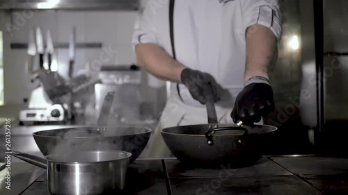 Wallpaper Mural Chefs cooks and doing flambe on vegetables in wok on restaurant kitchen Torontodigital.ca