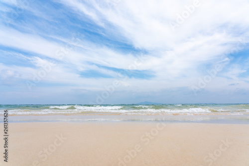 Soft wave of ocean on sand beach with blue ocean sea and sky background in summer vacation.Relaxing time on paradise.Travel,Holliday,Day off Concept. Copy space empty blank for text. © Poh Smith