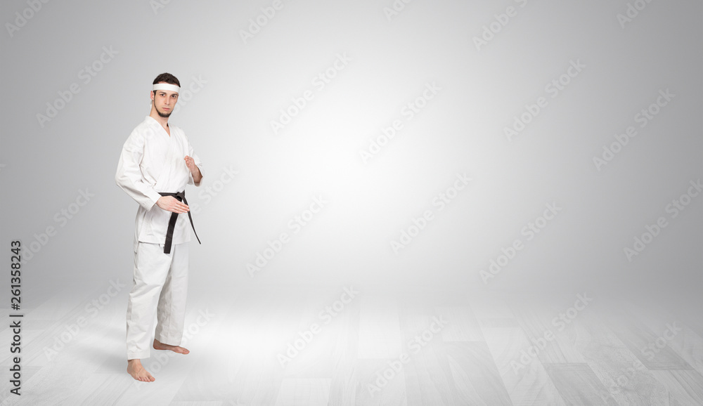Young kung-fu trainer fighting in an empty space
Young kung-fu trainer fighting in an empty space