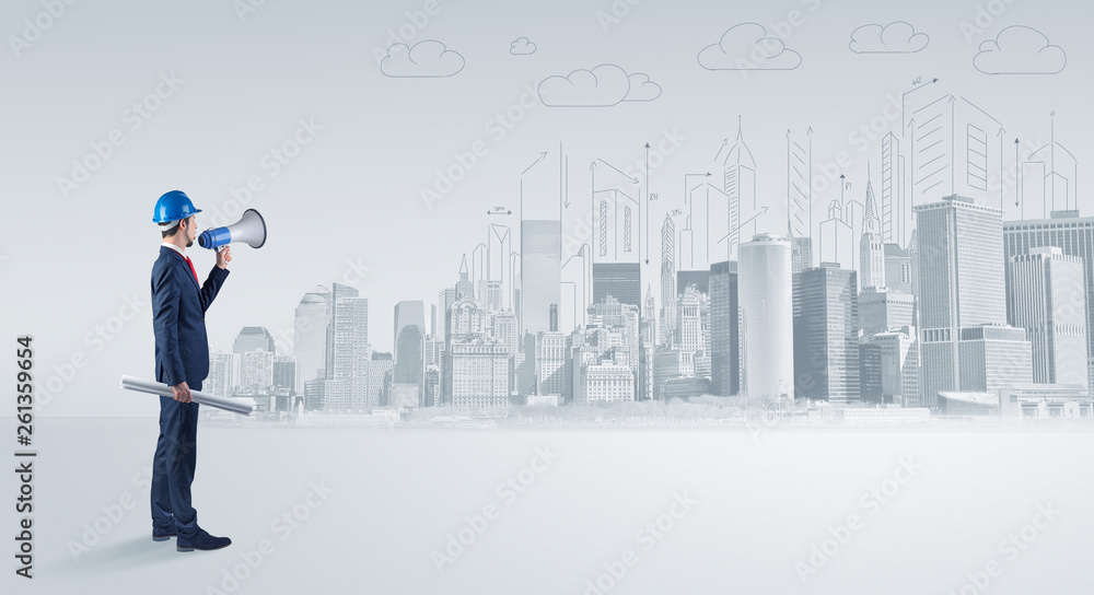 Young supervisor architect standing and replanning a big city panorama
Young supervisor architect standing and replanning a big city panorama