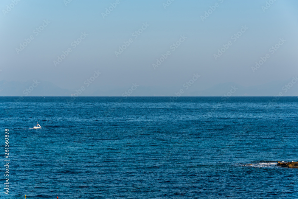 Tiny Fishing Boat on the Blue Italian Mediterranean Sea on a Clear Sunny Day