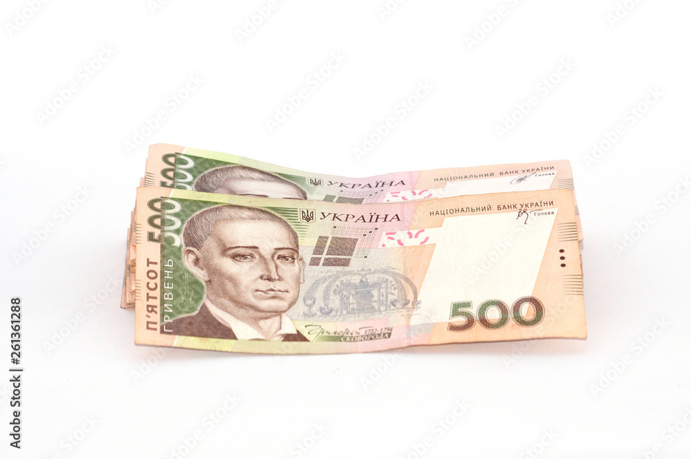 Money Ukrainian hryvnia on a white background, a large bundle of bills Money Ukrainian hryvnia on a white background, a large bundle of bills