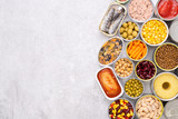 Canned food on stone background, top view with copy space