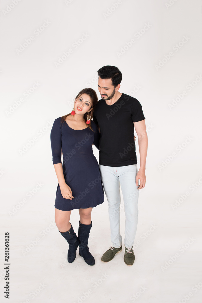young couple together posing on white background young couple together posing on white background