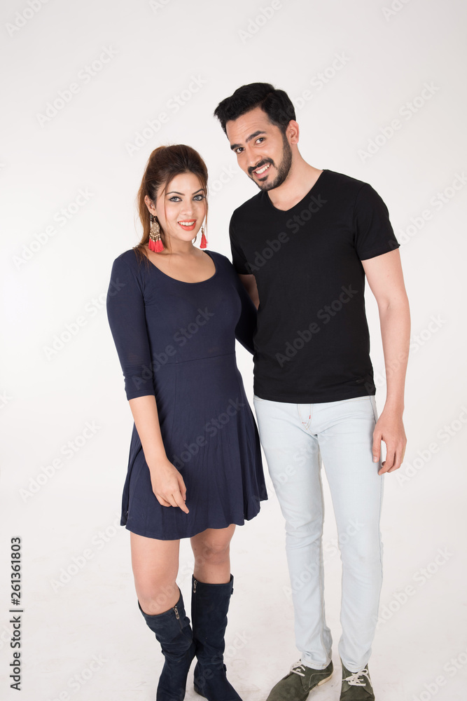 young couple together posing on white background young couple together posing on white background