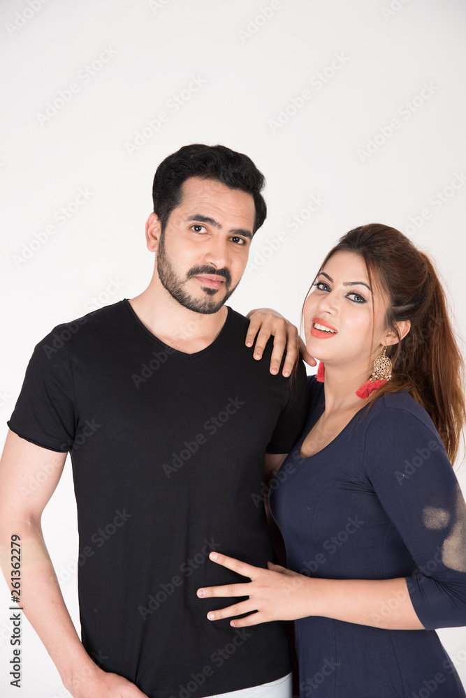 young couple together posing on white background young couple together posing on white background