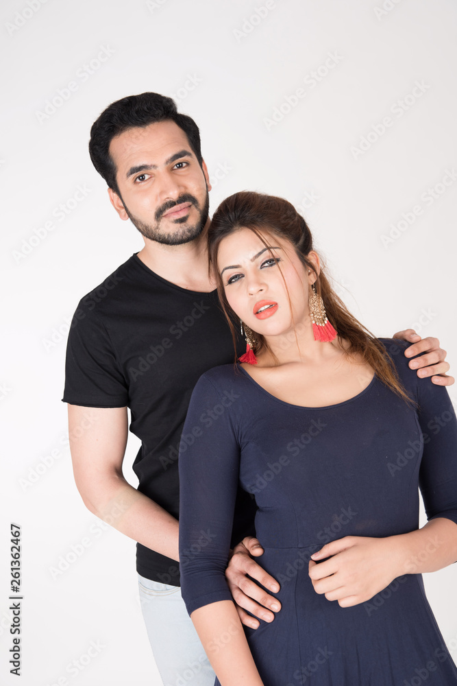 young couple together posing on white background young couple together posing on white background