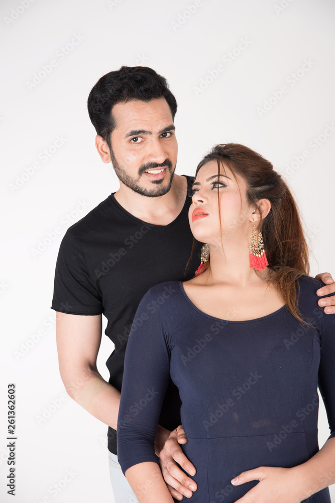young couple together posing on white background young couple together posing on white background