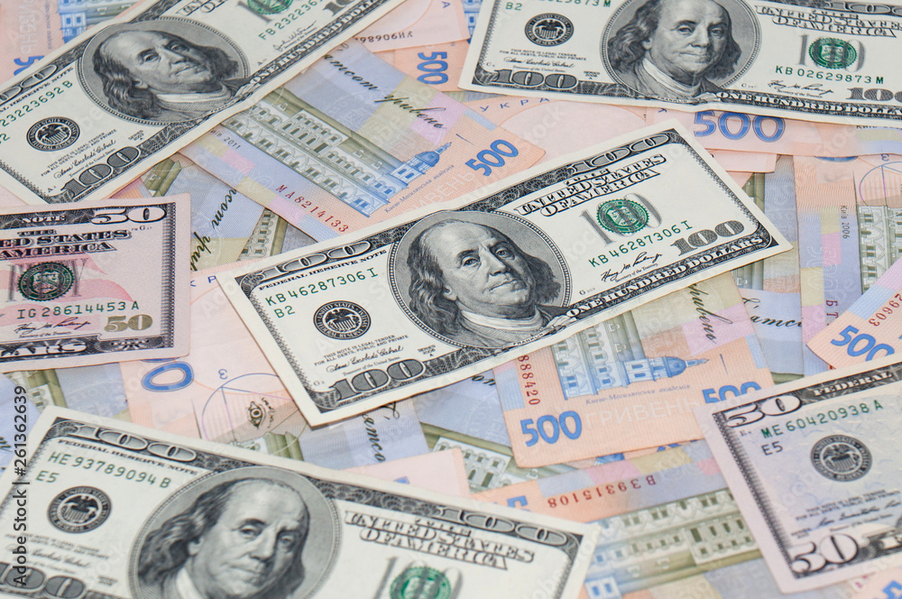 Money, dollars and hryvnia, close-up, top view. The concept of the dollar and the hryvnia, finance, banks. Money, dollars and hryvnia, close-up, top view. The concept of the dollar and the hryvnia, finance, banks.