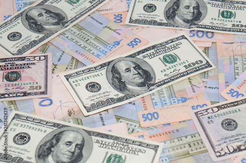 Money, dollars and hryvnia, close-up, top view. The concept of the dollar and the hryvnia, finance, banks.