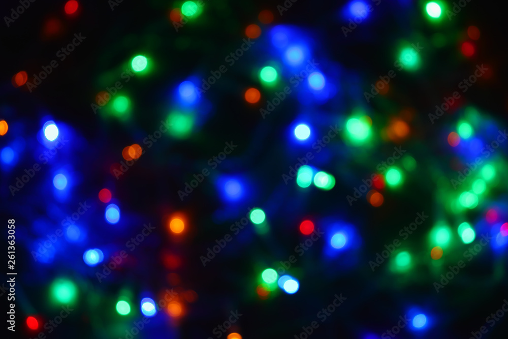 Colored lights (garland) in the dark. Bokeh effect Festive illumination. Colored lights (garland) in the dark. Bokeh effect Festive illumination.
