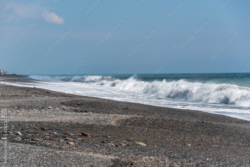 Volcanic Black Sand Beach and Blue Ionian Sea in Sicily Volcanic Black Sand Beach and Blue Ionian Sea in Sicily