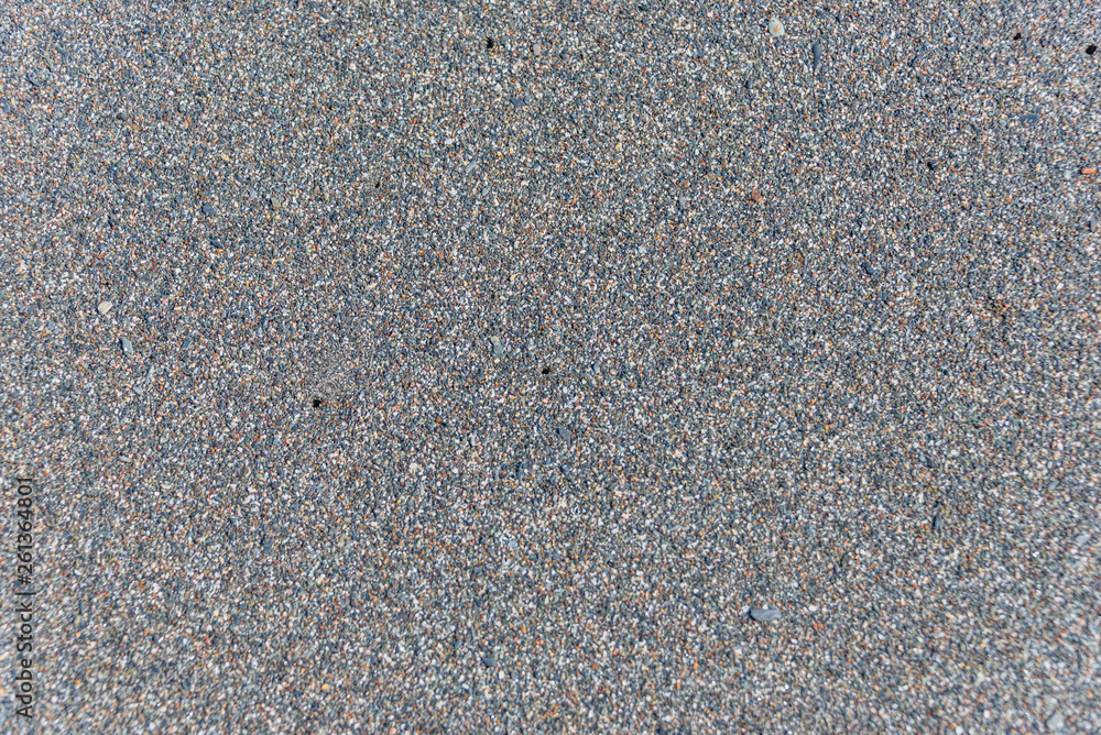 Closeup of Black Sand on a Volcanic Beach in Sicily for Backgrounds Closeup of Black Sand on a Volcanic Beach in Sicily for Backgrounds