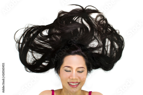 Closeup portrait of happy asian women  lying on ground with black long hair. acting smile  fun 