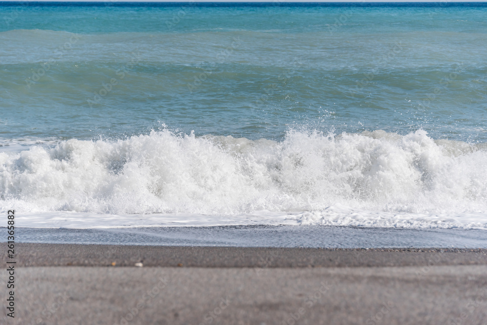 Cloudscape and Volcanic Black Sand Beach and Blue Ionian Sea in Sicily Cloudscape and Volcanic Black Sand Beach and Blue Ionian Sea in Sicily