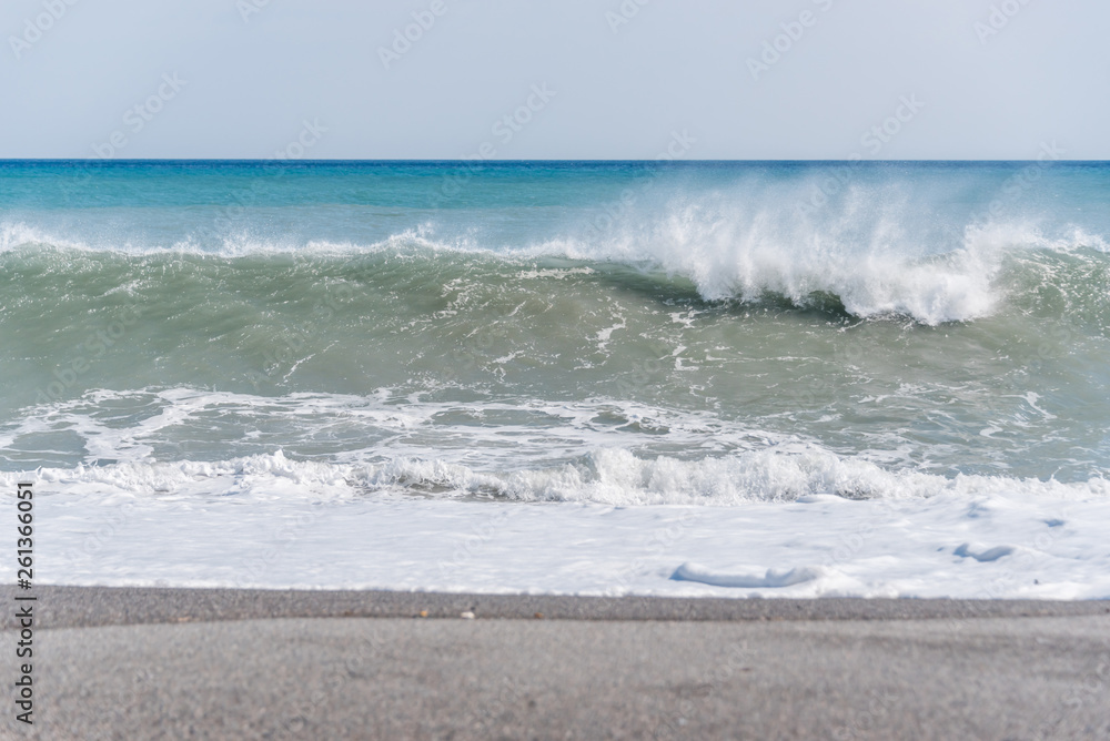 Cloudscape and Volcanic Black Sand Beach and Blue Ionian Sea in Sicily Cloudscape and Volcanic Black Sand Beach and Blue Ionian Sea in Sicily