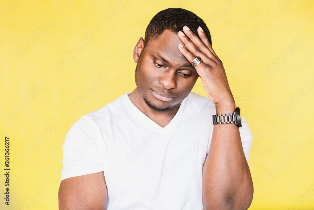Portrait of an African American man having stress, problems at work. Portrait of an African American man having stress, problems at work.
