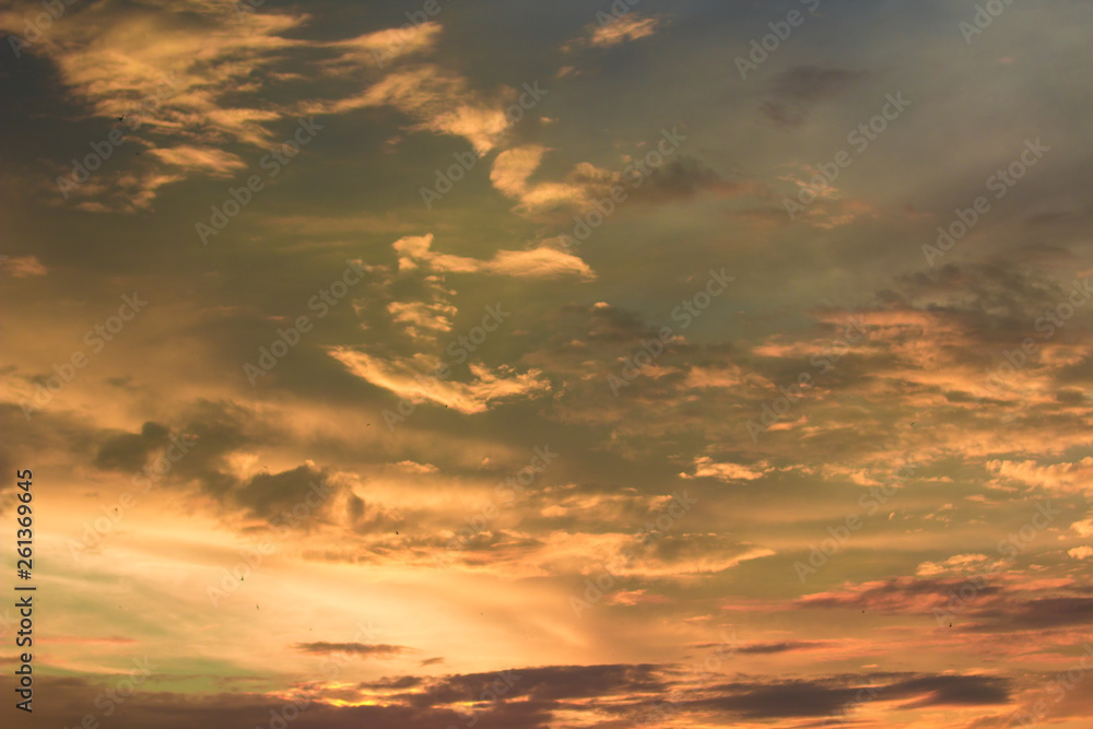 Vivid dramatic twilight sunset sky with colorful clouds and silhouettes of birds Vivid dramatic twilight sunset sky with colorful clouds and silhouettes of birds