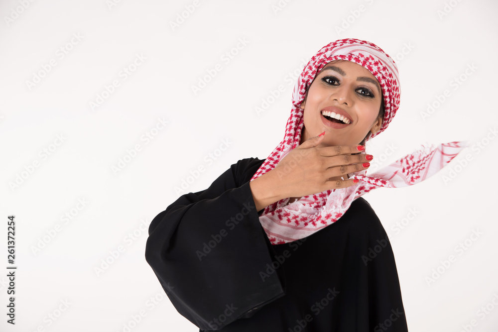 pretty young Arab female in traditional dress posing on white background pretty young Arab female in traditional dress posing on white background